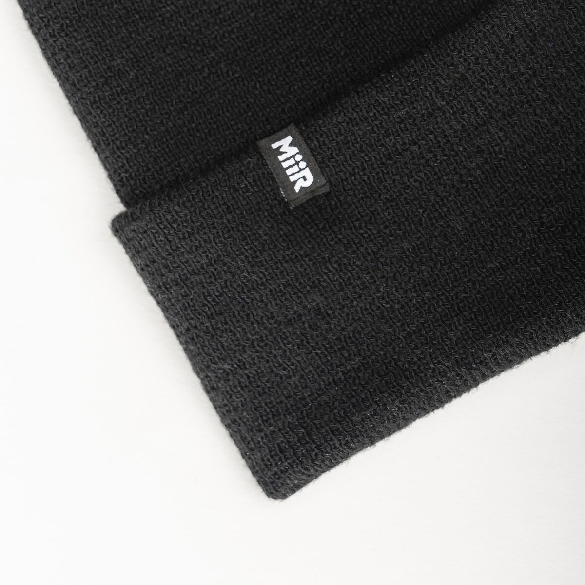 recycled-poly-fine-knit-beanie-t6 WebPDP-RecycledPolyFineKnitBeanie_Studio_TagDetail_Black__BNE005002OS.jpg