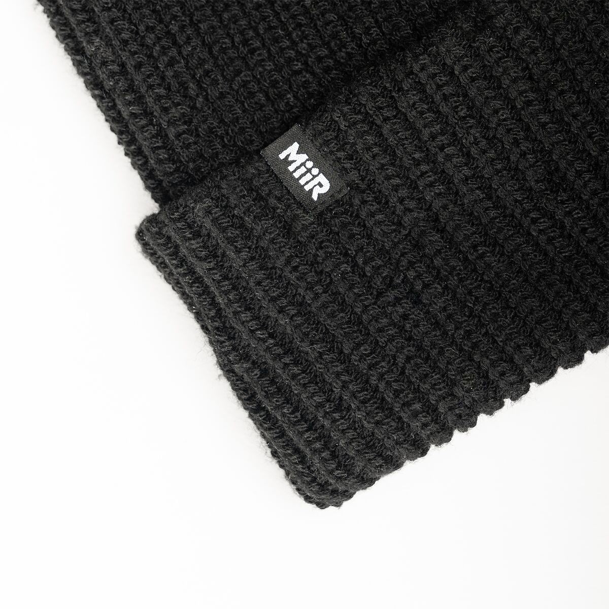 recycled-poly-rib-beanie-p0 WebPDP-RecycledPolyRibBeanie_Studio_TagDetail_Black__BNE002002OS.jpg